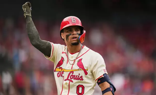 St. Louis Cardinals' Masyn Winn celebrates after hitting a sacrifice fly to score Nathan Church during the fifth inning of a baseball game against the Kansas City Royals Saturday, May 16, 2026, in St. Louis. (AP Photo/Jeff Roberson)