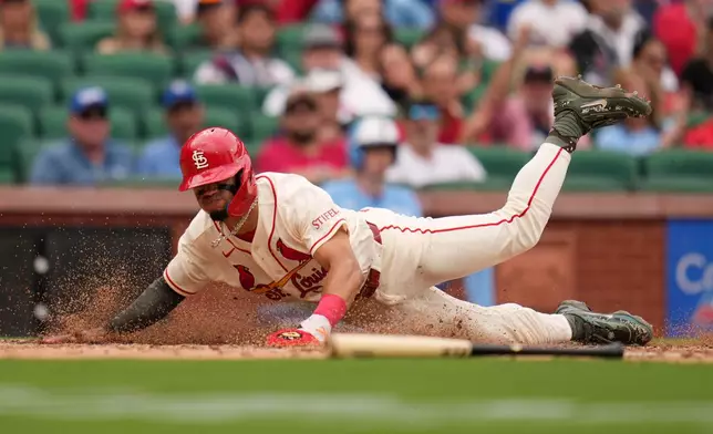 St. Louis Cardinals' Masyn Winn scores during the eighth inning of a baseball game against the Kansas City Royals Saturday, May 16, 2026, in St. Louis. (AP Photo/Jeff Roberson)