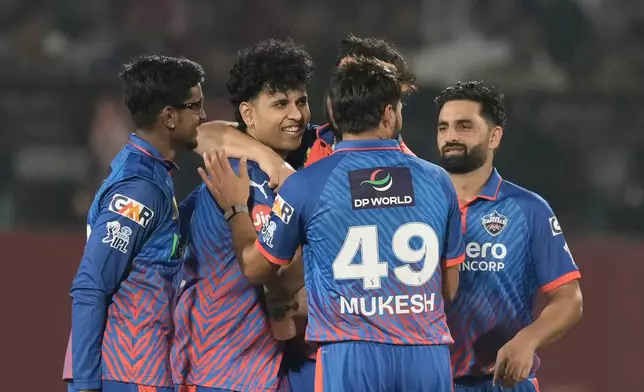 Delhi Capitals' Madhav Tiwari, second left, celebrates the wicket of Punjab Kings' Priyansh Arya with teammates during the Indian Premier League cricket match between Delhi Capitals and Punjab Kings in Dharamshala, India, Monday, May 11, 2026. (AP Photo/Ashwini Bhatia)