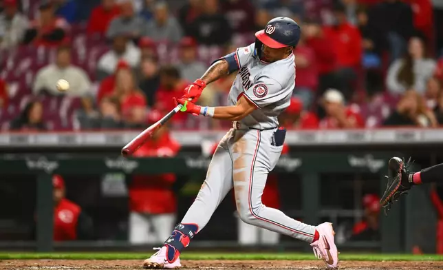 Washington Nationals' Daylen Lile hits a two-run home run during the tenth inning of a baseball game against the Cincinnati Reds in Cincinnati, Wednesday, May 13, 2026. (AP Photo/Ben Jackson)
