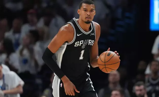 San Antonio Spurs forward Victor Wembanyama (1) moves on the court against the Oklahoma City Thunder in the second half of Game 5 in the Western Conference finals NBA basketball playoffs series, Tuesday, May 26, 2026, in Oklahoma City. (AP Photo/Julio Cortez)