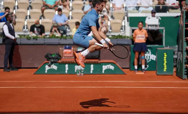 Arthur Gea of France warms up before the first round men's singles tennis match against Karen Khachanov of Russia at the French Open tennis tournament in Paris, Sunday, May 24, 2026. (AP Photo/Aurelien Morissard)