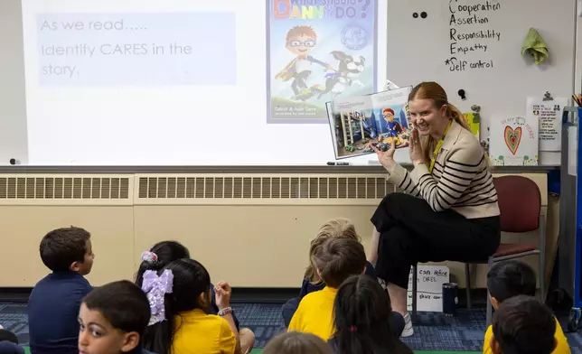 Media specialist Alison Kimble reads to her class at Valley View Elementary School on April 29, 2026, in Columbia Heights, Minn. (Ellen Schmidt/MinnPost via AP)