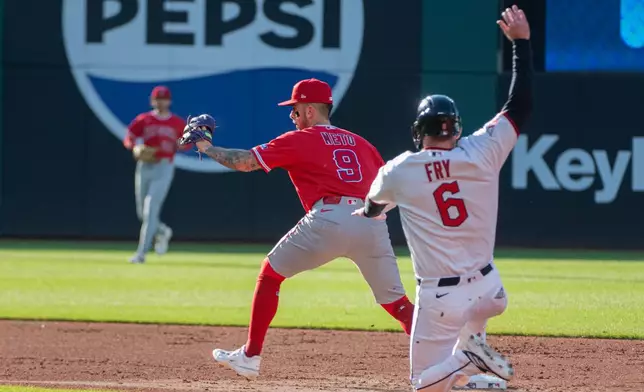 Los Angeles Angels' Zach Neto (9) forces out Cleveland Guardians' David Fry (6) at second base during the second inning of a baseball game, Monday, May 11, 2026, in Cleveland. (AP Photo/Phil Long)
