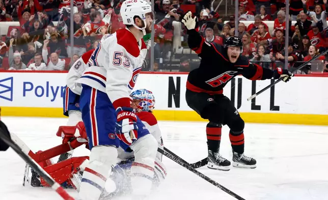 Carolina Hurricanes' Eric Robinson (50) reacts to the game wining overtime goal by Nikolaj Ehlers during overtime in Game 2 of the Eastern Conference final NHL hockey Stanley Cup playoff series in Raleigh, N.C., Saturday, May 23, 2026. (AP Photo/Karl DeBlaker)