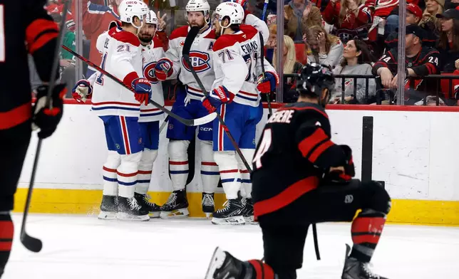 Montreal Canadiens celebrate a goal against the Carolina Hurricanes during the first period in Game 2 of the Eastern Conference finals NHL hockey Stanley Cup playoff series in Raleigh, N.C., Saturday, May 23, 2026. (AP Photo/Karl DeBlaker)