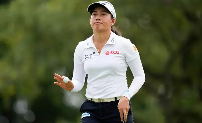 Jeeno Thitikul, of Thailand, waves after making a putt on the 13th hole during the second round of the Chevron Championship LPGA golf tournament Friday, April 24, 2026, in Houston. (AP Photo/Ashley Landis)