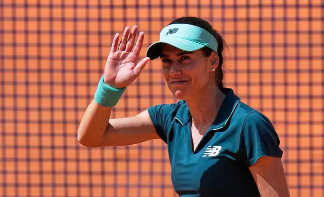 Sorana Cirstea of Romania celebrates after beating Jelena Ostapenko of Latvia in their match at the Italian Open tennis tournament in Rome, Tuesday, May 12, 2026. (AP Photo/Alessandra Tarantino)