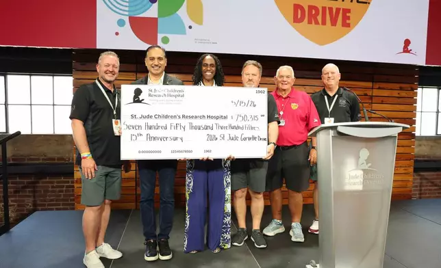 St. Jude Corvette Drive organizers present a $750,315 donation marking the event’s 15th anniversary. Courtesy of ALSAC/St. Jude Children’s Research Hospital.