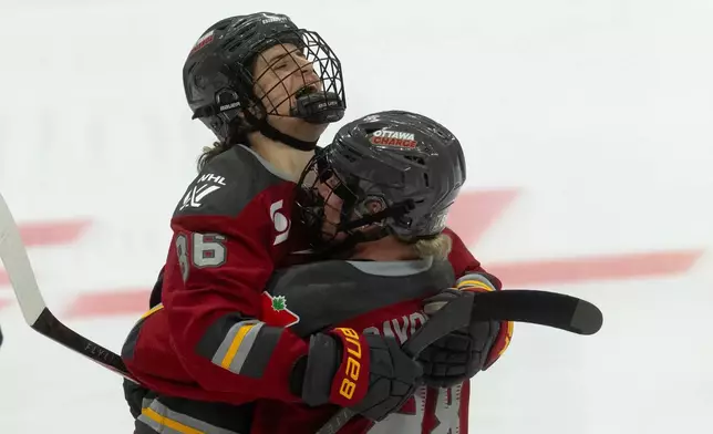 Ottawa Charge forward Michela Cava (86) celebrates after her winning goal with defense Ronja Savolainen (88) in the second overtime of Game 4 in a PWHL hockey playoff series against the Boston Fleet in Ottawa, Ontario, Sunday, May 10, 2026. (Adrian Wyld/The Canadian Press)