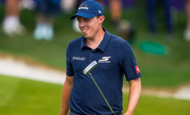 Matthew Fitzpatrick, of England, reacts to a missed putt on the 18th hole during first round of the Truist Championship golf tournament at the Quail Hollow Club, Thursday, May 7, 2026, in Charlotte, N.C. (AP Photo/Chris Carlson)