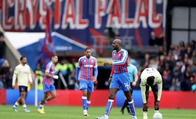 Crystal Palace's Jean-Philippe Mateta, second right, after scoring during the English Premier League soccer match between Crystal Palace and Everton in London, Sunday May 10, 2026. (Steven Paston/PA via AP)