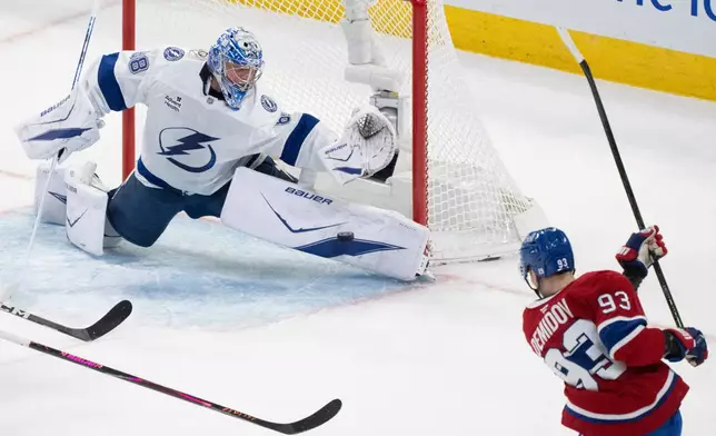 Tampa Bay Lightning goaltender Andrei Vasilevskiy (88) stops a shot by Montreal Canadiens' Ivan Demidov (93) during the second period of Game 6 in the first round of an NHL hockey Stanley Cup playoff series in Montreal, Friday, May 1, 2026. (Christinne Muschi/The Canadian Press via AP)