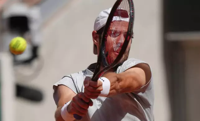 Karen Khachanov of Russia returns to Arthur Gea of France during the first round men's singles tennis match at the French Open tennis tournament in Paris, Sunday, May 24, 2026. (AP Photo/Aurelien Morissard)