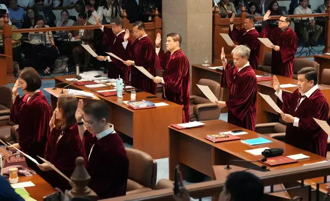 Philippine senators take oath as they convene as an impeachment court for the trial of Vice President Sara Duterte at the Philippine senate, Monday, May 18, 2026, in Pasay, Philippines. (AP Photo/Aaron Favila)