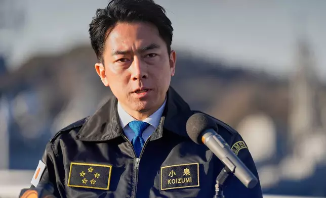 FILE - Japan's Defense Minister Shinjiro Koizumi speaks with media at the headquarters of the Japan Maritime Self-Defense Force Yokosuka District, south of Tokyo, on Jan. 30, 2026. (AP Photo/Eugene Hoshiko, Pool, File)