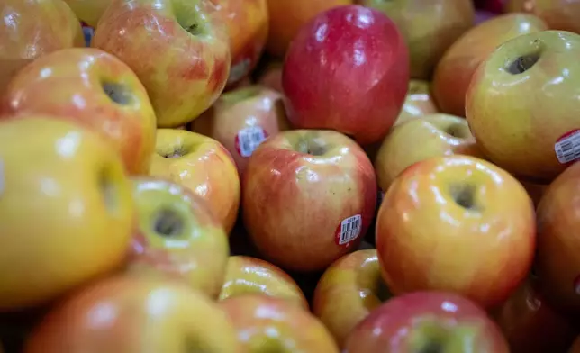 Apples are displayed for sale in the produce section of a grocery store on Monday, May 11, 2026, in Portland, Ore. (AP Photo/Jenny Kane)