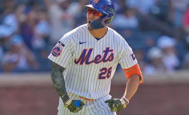 New York Mets' Tyrone Taylor reacts after hitting a three-run home run during the ninth inning of a baseball game against the New York Yankees, Sunday, May 17, 2026, in New York. (AP Photo/Seth Wenig)