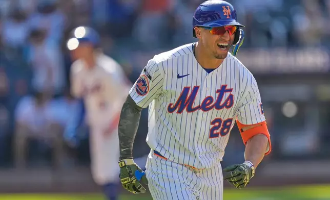 New York Mets' Tyrone Taylor reacts after hitting a three-run home run during the ninth inning of a baseball game against the New York Yankees, Sunday, May 17, 2026, in New York. (AP Photo/Seth Wenig)