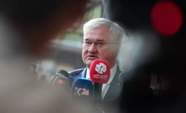 Ukraine's Foreign Minister Andrii Sybiha speaks with the media as he arrives for a meeting of EU foreign ministers at the European Council building in Brussels, Monday, May 11, 2026. (AP Photo/Virginia Mayo)