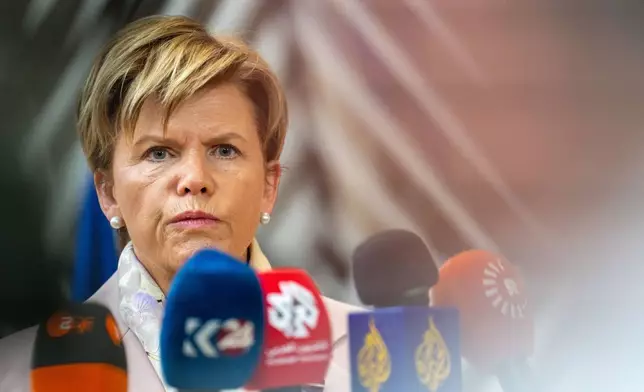Latvia's Foreign Minister Baiba Braze speaks with the media as she arrives for a meeting of EU foreign ministers at the European Council building in Brussels, Monday, May 11, 2026. (AP Photo/Marius Burgelman)