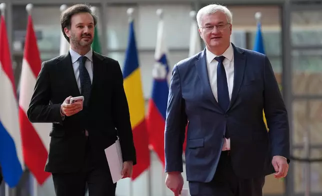 Ukraine's Foreign Minister Andrii Sybiha, right, arrives for a meeting of EU foreign ministers at the European Council building in Brussels, Monday, May 11, 2026. (AP Photo/Virginia Mayo)