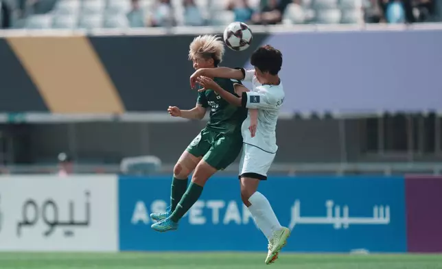 Tokyo Verdy Beleza's Rihona Ujihara, left, battles for the ball against Naegohyang Women's FC's Ri Myong Gum during the AFC Women's Champions League soccer final match in Suwon, South Korea, Saturday, May 23, 2026. (AP Photo/Lee Jin-man)