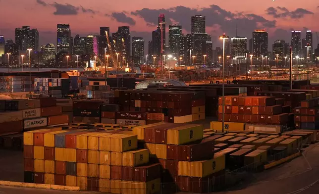 FILE - Shipping containers sit stacked at PortMiami, in front of the downtown Miami skyline, at sunset on April 16, 2025. (AP Photo/Rebecca Blackwell, File)