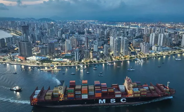 FILE - A container ship approaches the port of Santos in Brazil, April 1, 2025. (AP Photo/Andre Penner, File)