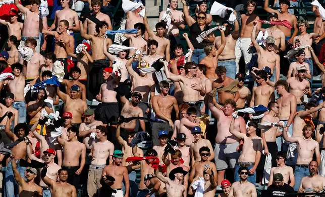 Fans participate go "tarps off" during the fifth inning of a baseball game between the Texas Rangers and the Los Angeles Angels, Sunday, May 24, 2026, in Anaheim, Calif. (AP Photo/Caroline Brehman)