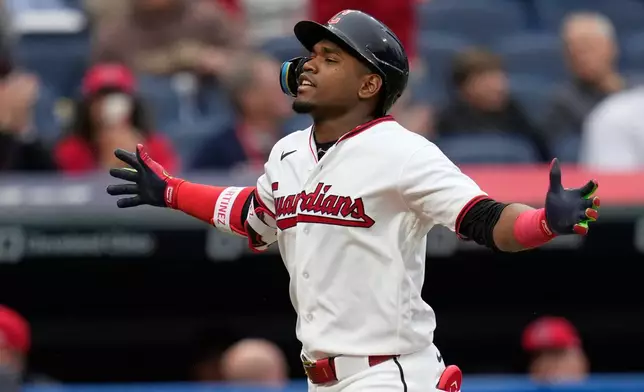 Cleveland Guardians 'Angel Martínez gestures as he runs toward home plate with a solo home run in the third inning of a baseball game against the Los Angeles Angels in Cleveland, Tuesday, May 12, 2026. (AP Photo/Sue Ogrocki)