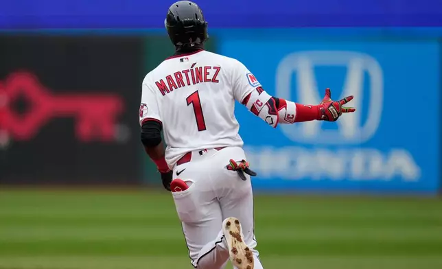Cleveland Guardians 'Angel Martínez gestures as he runs the bases with a solo home run in the third inning of a baseball game against the Los Angeles Angels in Cleveland, Tuesday, May 12, 2026. (AP Photo/Sue Ogrocki)