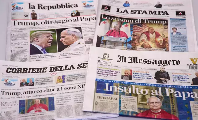 FILE - This picture, taken Tuesday, April 14, 2026, shows the front pages of some Italian newspapers reporting on comments by U.S. President Donald Trump about Pope Leo XIV, with headlines using words such as "outrage", "shock attack", "insult", and Trump's schism". (AP Photo/Domenico Stinellis)