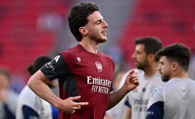 Arsenal's Declan Rice warms up during a training session ahead of the Champions League final soccer match between Paris Saint-Germain and Arsenal in Budapest, Hungary, Friday, May 29, 2026. (AP Photo/Denes Erdos)