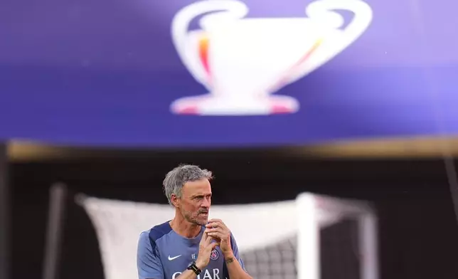 PSG's head coach Luis Enrique directs a training session ahead of the Champions League final soccer match between Paris Saint-Germain and Arsenal in Budapest, Hungary, Friday, May 29, 2026. (AP Photo/Andreea Alexandru)