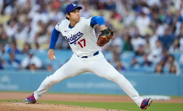 Los Angeles Dodgers pitcher Shohei Ohtani throws to the plate during the first inning of a baseball game against the San Francisco Giants, Wednesday, May 13, 2026, in Los Angeles. (AP Photo/Mark J. Terrill)