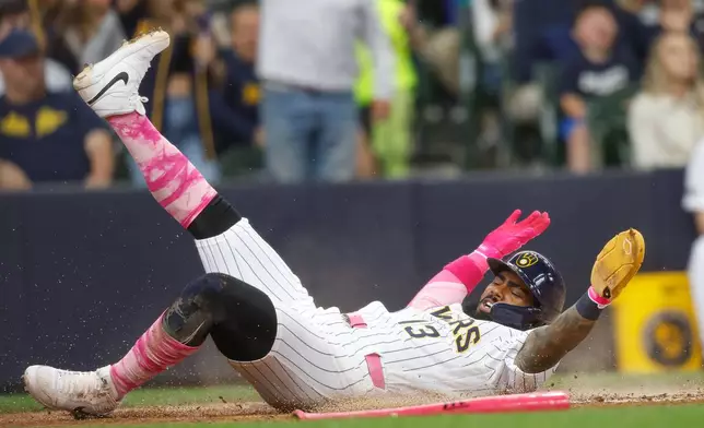 Milwaukee Brewers' Luis Rengifo scores during the fourth inning of a baseball game against the New York Yankees, Sunday, May 10, 2026, in Milwaukee. (AP Photo/Jeffrey Phelps)