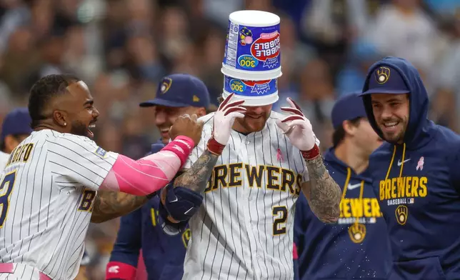 Milwaukee Brewers' Brice Turang (2) reacts with teammates after his walk off home run in the ninth inning against the New York Yankees, Sunday, May 10, 2026, in Milwaukee. (AP Photo/Jeffrey Phelps)