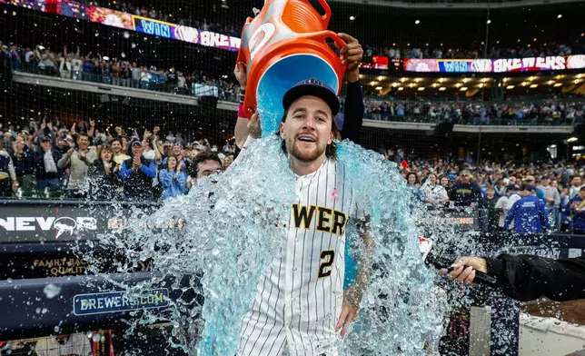 Milwaukee Brewers' Brice Turang is dunked with gatorade after hitting a walk-off home run in the ninth inning against the New York Yankees Sunday, May 10, 2026, in Milwaukee. (AP Photo/Jeffrey Phelps)