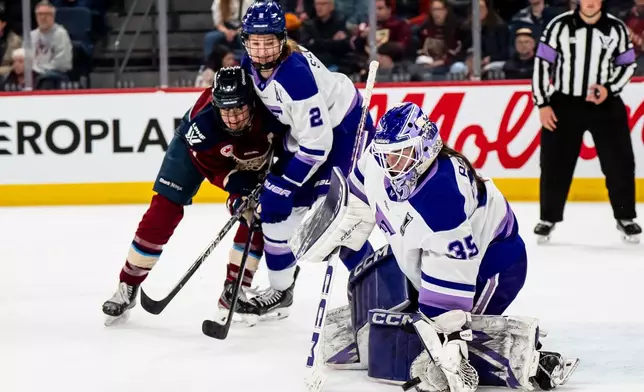 Minnesota Frost goaltender Maddie Rooney (35) makes a glove save against the Montréal Victoire during first overtime period of an PWHL playoff hockey game in Laval, Que., on Tuesday, May 5, 2026. (Christopher Katsarov/The Canadian Press via AP)