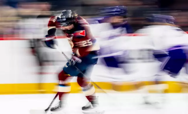Montreal Victoire's Lina Ljungblom (25) moves the puck past the Minnesota Frost's defense during third period PWHL playoff hockey action in Laval, Que., on Tuesday, May 5, 2026. (Christopher Katsarov/The Canadian Press via AP)