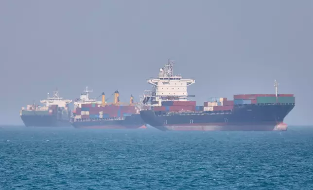 Container ships sit at anchor in the Strait of Hormuz off Bandar Abbas, Iran, Saturday, May 2, 2026.(Amirhosein Khorgooi/ISNA via AP)