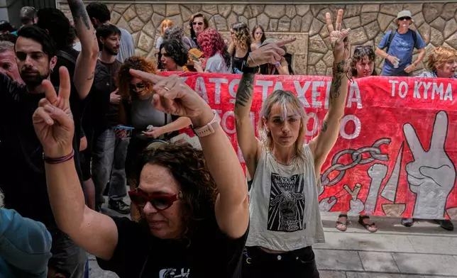 Protesters chant pro-Palestinian slogans outside Greece's Foreign Ministry after Israel's navy intercepted an activist flotilla in waters off of Cyprus, in Athens, Tuesday, May 19, 2026. (AP Photo/Thanassis Stavrakis)
