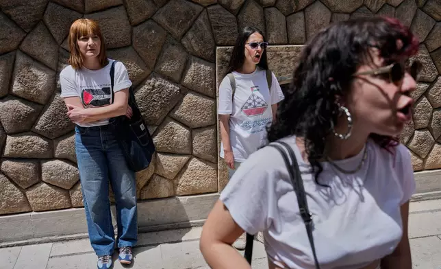 Protesters chant pro-Palestinian slogans outside Greece's Foreign Ministry after Israel's navy intercepted an activist flotilla in waters off of Cyprus, in Athens, Tuesday, May 19, 2026. (AP Photo/Thanassis Stavrakis)