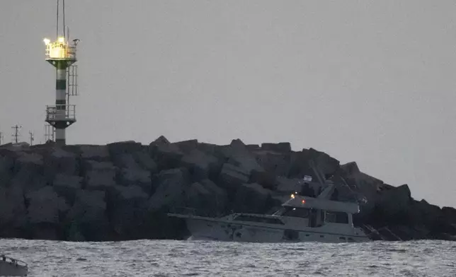 Israeli naval forces sail a confiscated Gaza-bound flotilla boat into Israel's Ashdod port after intercepting the vessel on the Mediterranean Sea, Tuesday, May 19, 2026. (AP Photo/Ariel Schalit)