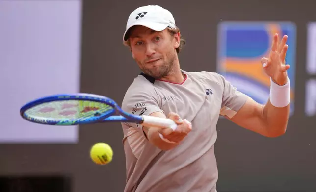 Casper Ruud of Norway returns a ball to Luciano Darderi of Italy during their semifinal match at the Italian Open tennis tournament in Rome, Friday, May 15, 2026. (AP Photo/Andrew Medichini)
