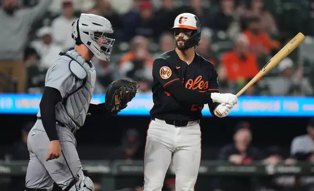 Baltimore Orioles' Blaze Alexander, right, reacts after striking out on a foul tip during the ninth inning in the second baseball game of a doubleheader against the Detroit Tigers, Sunday, May 24, 2026, in Baltimore. (AP Photo/Stephanie Scarbrough)