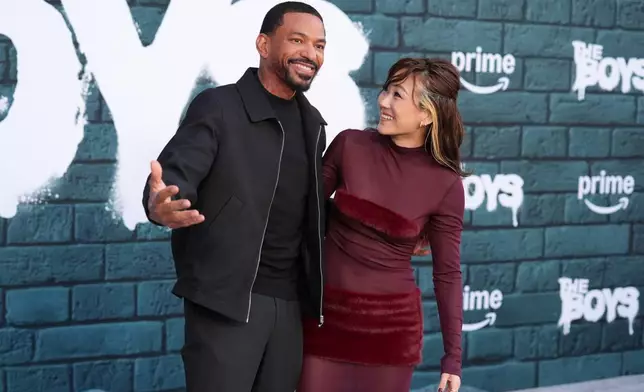 Cast members Laz Alonso, left, and Karen Fukuhara pose together at the premiere of the series finale of the fifth season of the Amazon Prime Video series "The Boys" on Tuesday, May 19, 2026, at The United Theater on Broadway in Los Angeles. (AP Photo/Chris Pizzello)