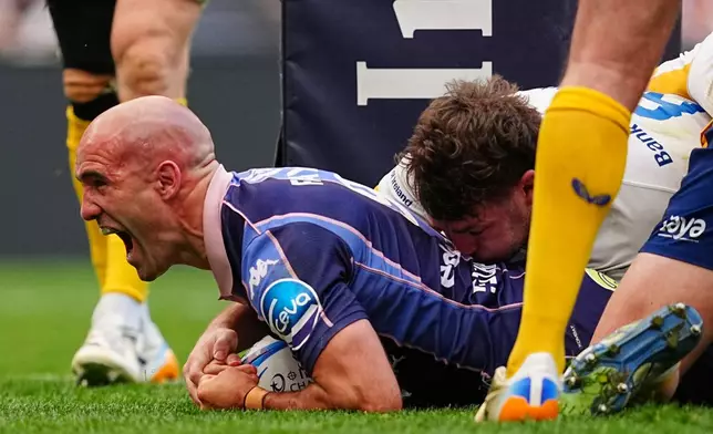 Bordeaux's Maxime Lucu celebrates after scoring a try during the European Champions Cup final rugby union match between Leinster and Bordeaux in Bilbao, Spain, Saturday, May 23, 2026. (AP Photo/Miguel Oses)