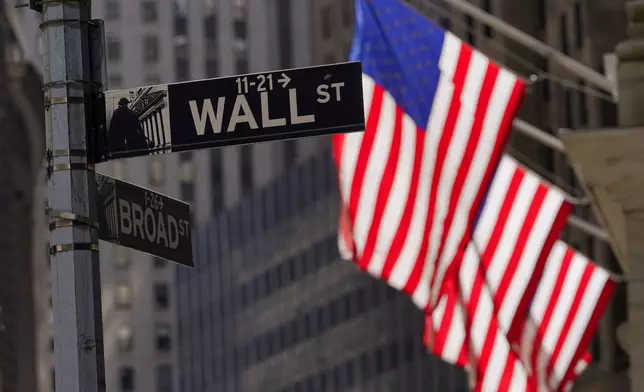FILE - American flags fly outside the New York Stock Exchange, Friday, Sept. 23, 2022, in New York. (AP Photo/Mary Altaffer, File)